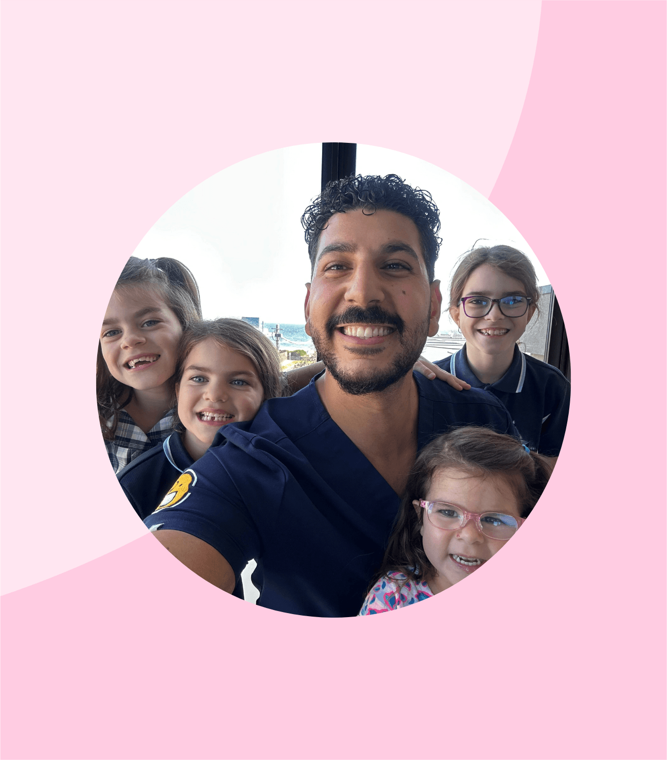 Joseph Hanna, registered Oral Health Therapist, with young patients in clinic